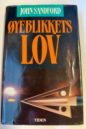 Øyeblikkets lov av John Sandford - Forside