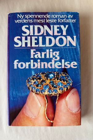 Farlig forbindelse av Sidney Sheldon - Forside