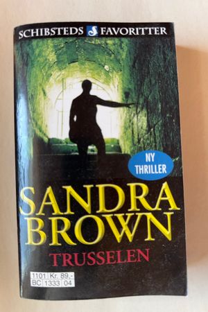 Trusselen av Sandra Brown - Forside